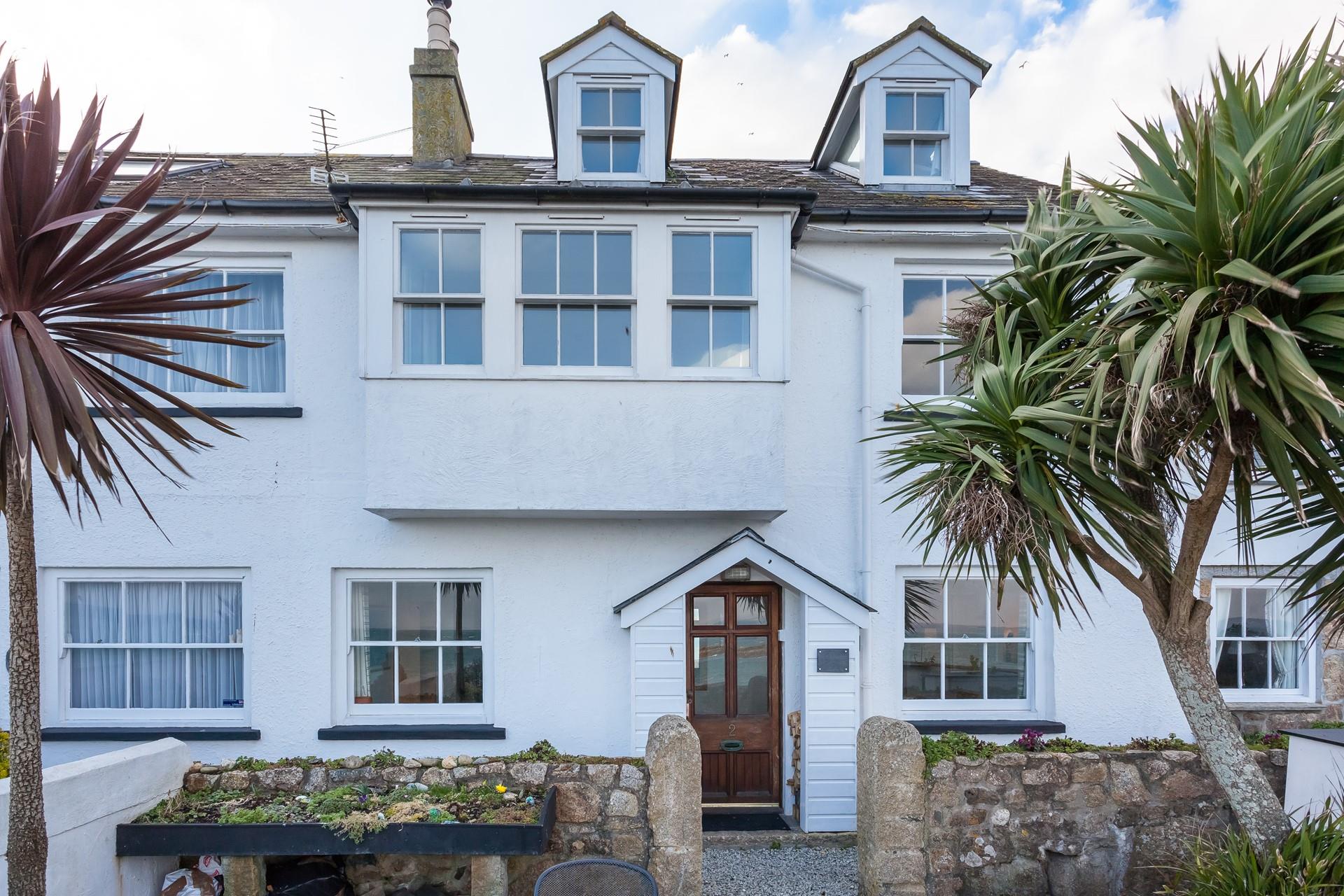 Explore the quaint shops and cafes of Mousehole.