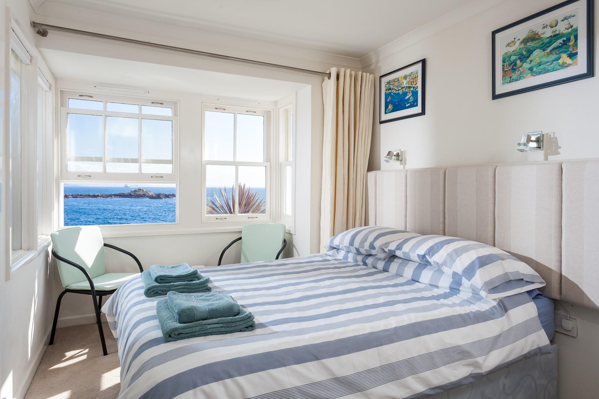 Wake up and open the curtains to stunning sea views.