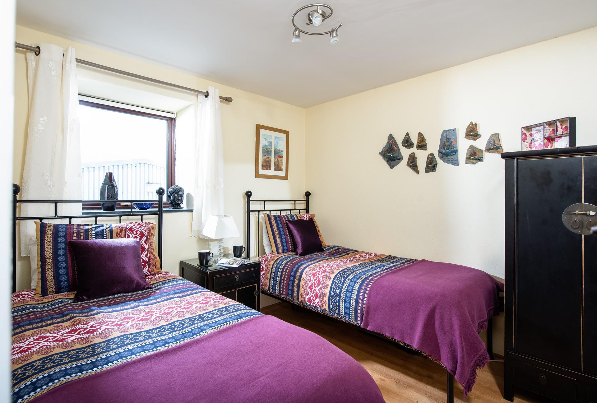 The twin room is perfect for adults and children to enjoy a comfortable night's sleep. 