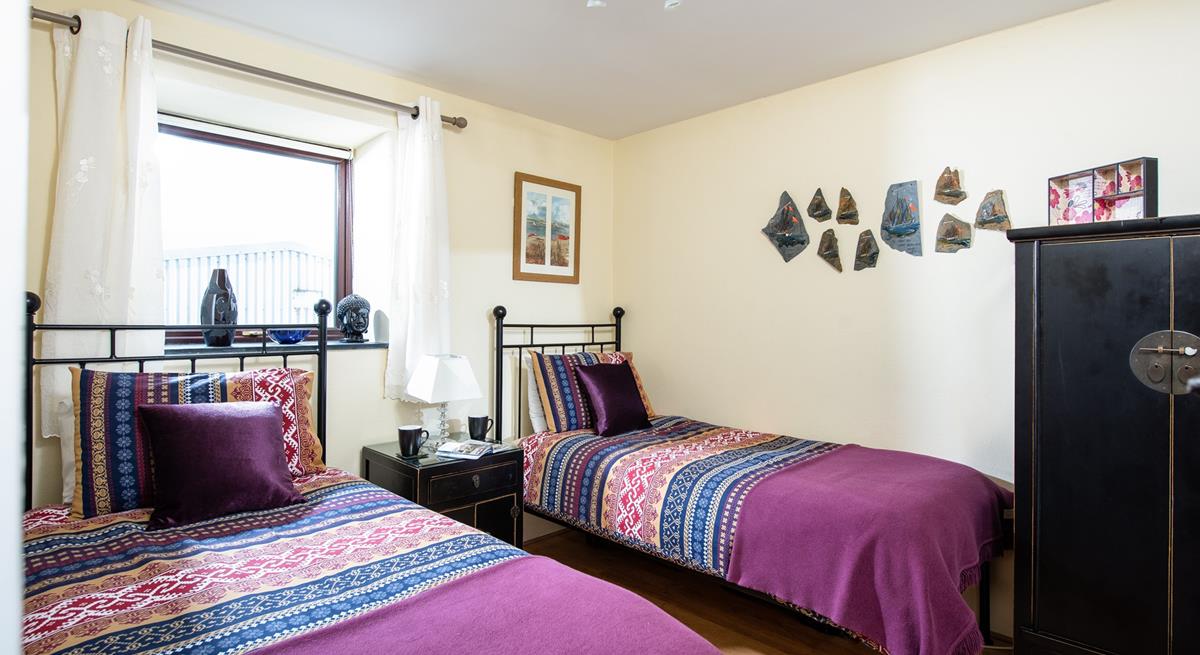 The twin room is perfect for adults and children to enjoy a comfortable night's sleep. 