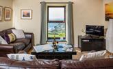 Pour yourself a glass of your favourite wine and enjoy the views from the sitting room. - Thumbnail Image