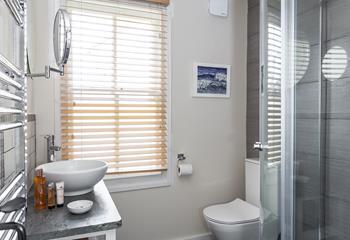 Underfloor heating keeps the family shower room nice and cosy.