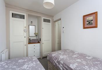 Built-in wardrobes and drawers provide lots of storage space during your stay. 