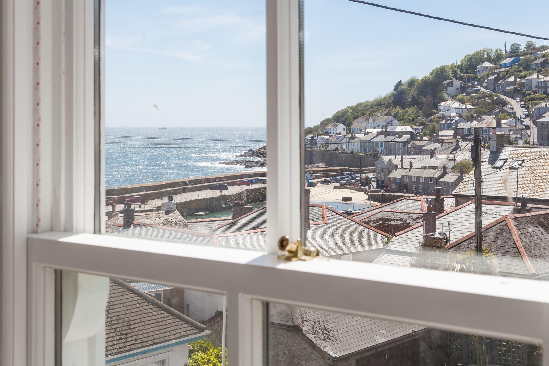 Step outside and stroll down to Mousehole Harbour.