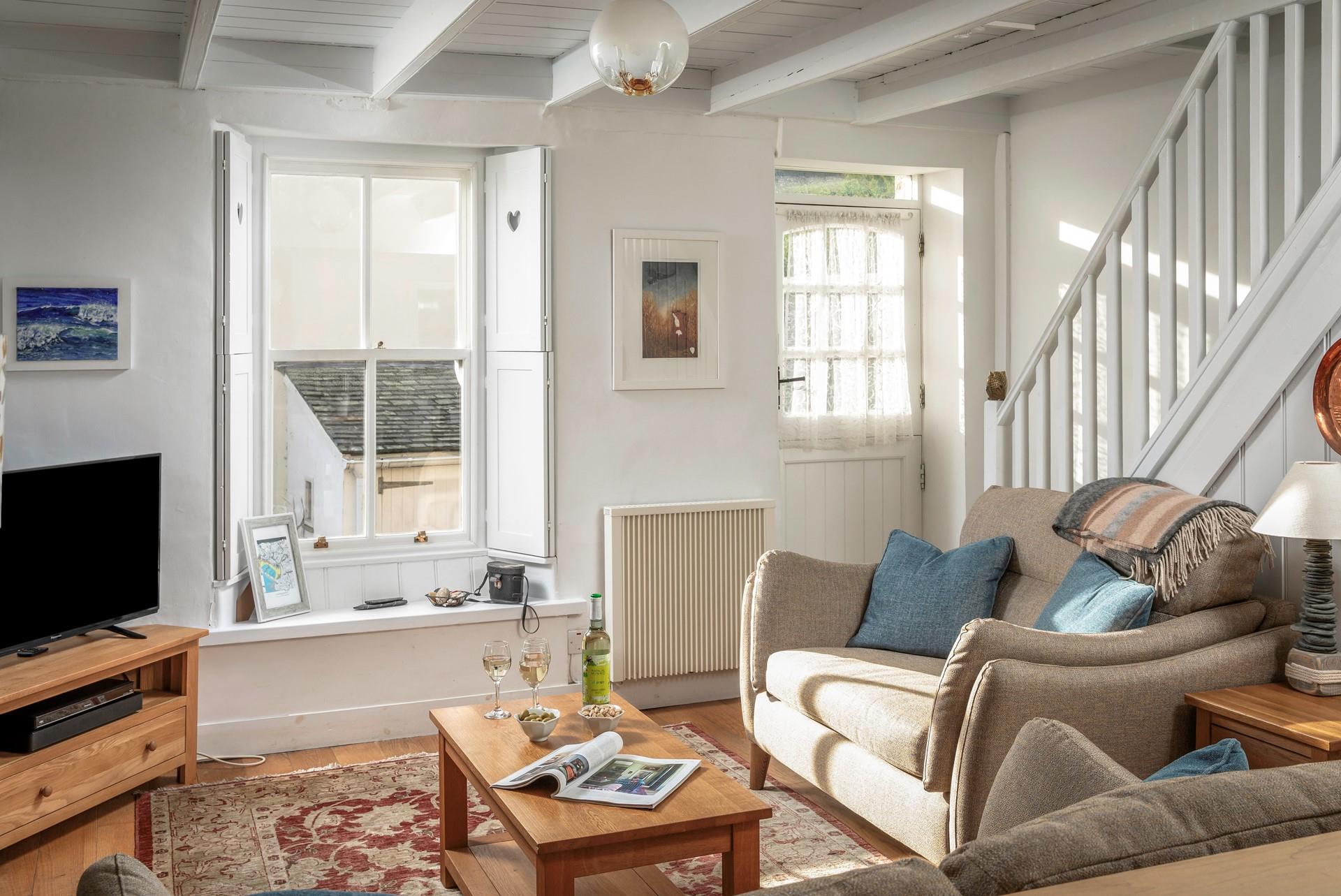 Sink into the comfortable sofa and enjoy a cold glass of wine.