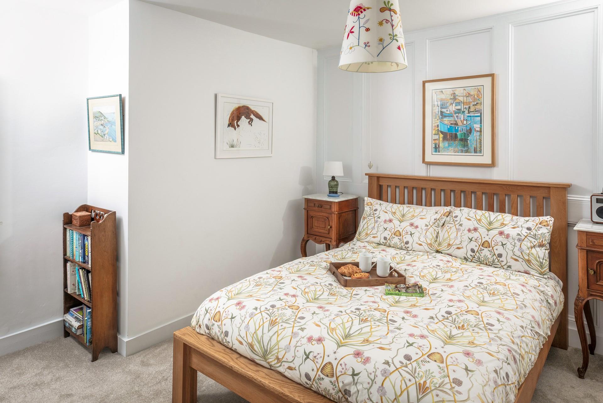 A homely double bedroom to relax on holiday.