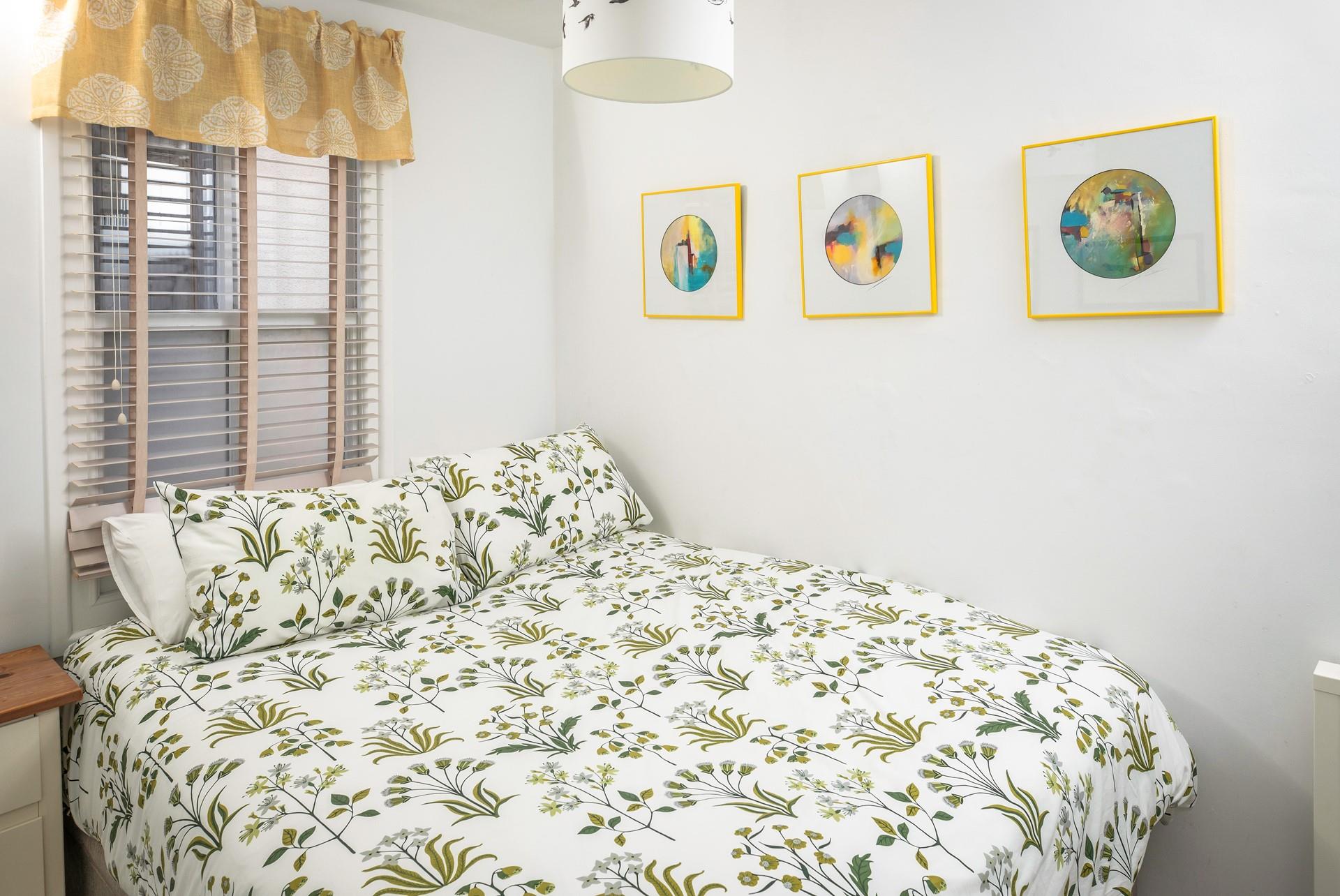 Bedroom 2 is compact and comfortable, perfect for little ones to drift off after busy beach days.