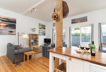 Enjoy a glass of wine with family and friends in the open plan living area.