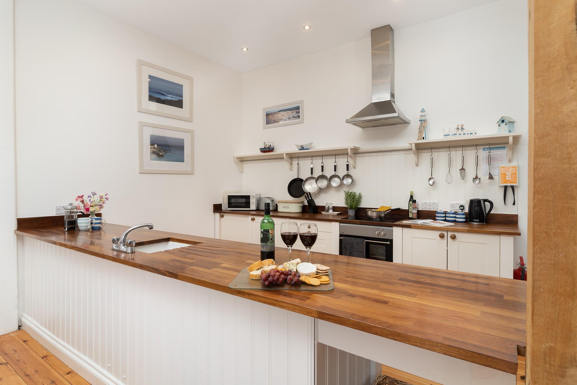 Modern, with a welcoming country-feel, the kitchen is a joy to cook in.