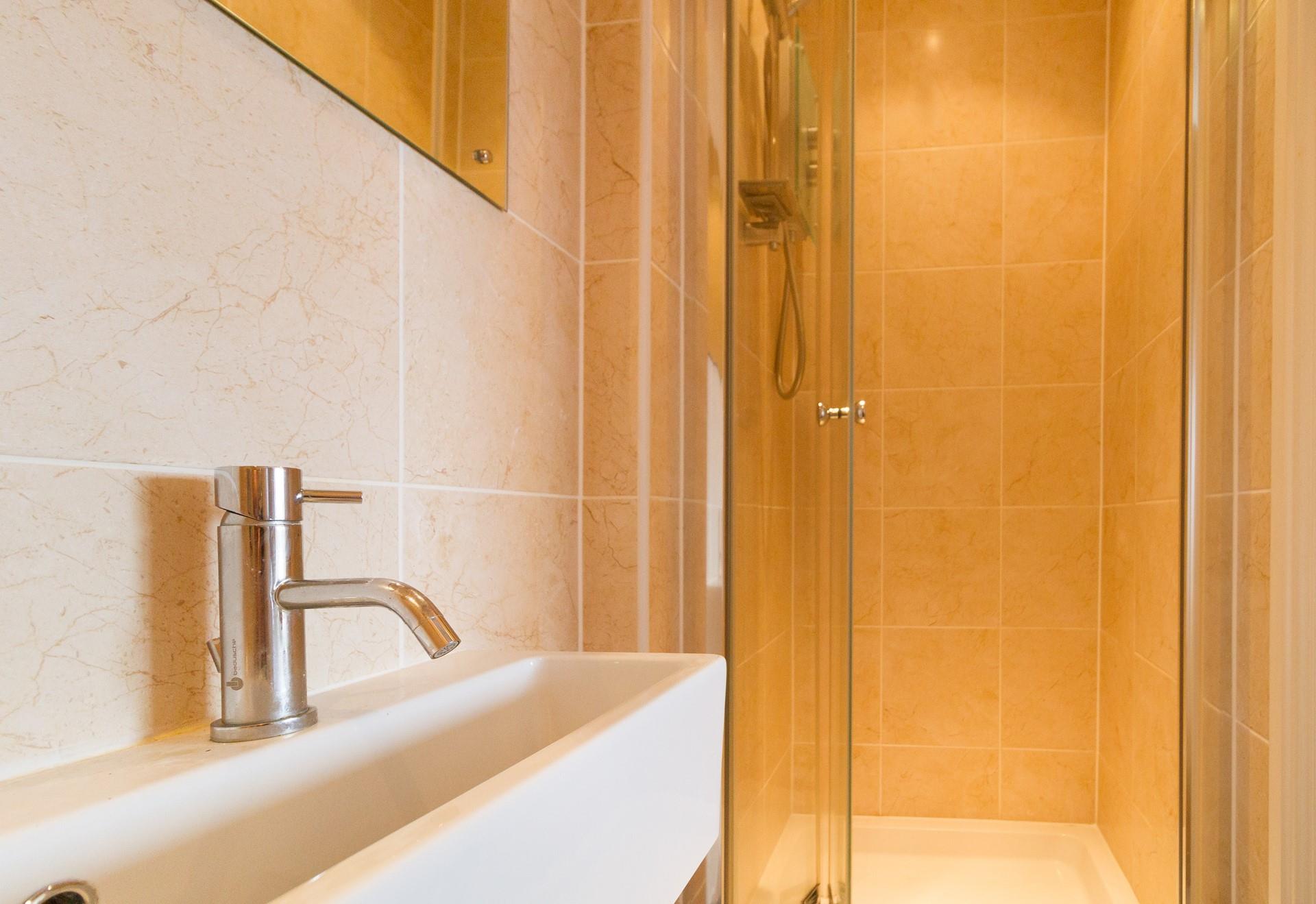 Wash off sandy feet in the shower after a beach day.