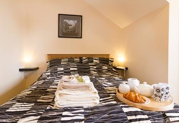 Indulge in breakfast in bed in the cosy second bedroom.