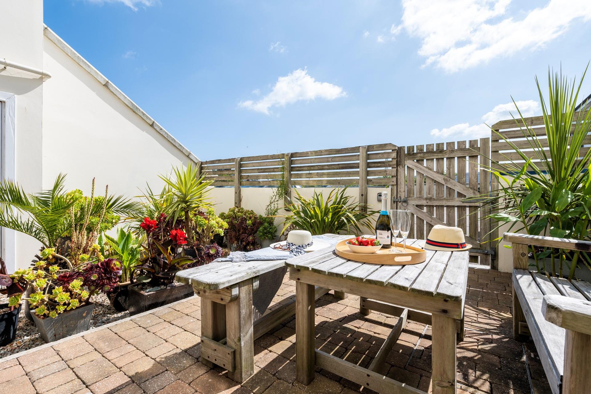 Feel a world away from daily life in the tropical style garden.