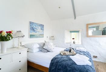 Snuggle into bed for a dreamy night's sleep after spending the day walking the South West Coast Path.