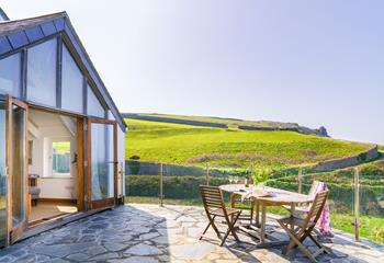 Open the patio doors of the sun room to let in the Cornish sea air.
