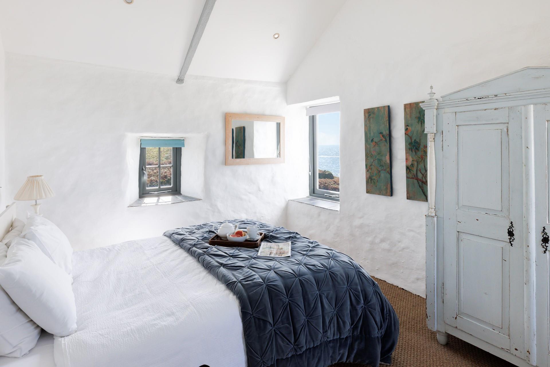 Snuggle into bed for a dreamy night's sleep after spending the day walking the South West Coast Path.