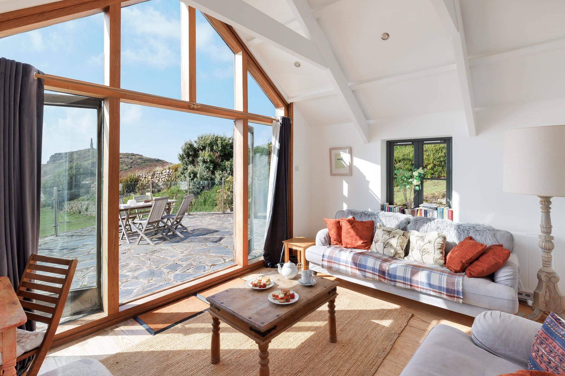 Relax in the sitting room looking out at sea with the woodburner crackling in the background.