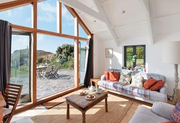 Relax in the sitting room looking out at sea with the woodburner crackling in the background.