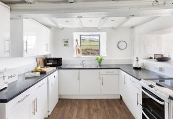 Take in the sea views as the kitchen steps down into the sun room.
