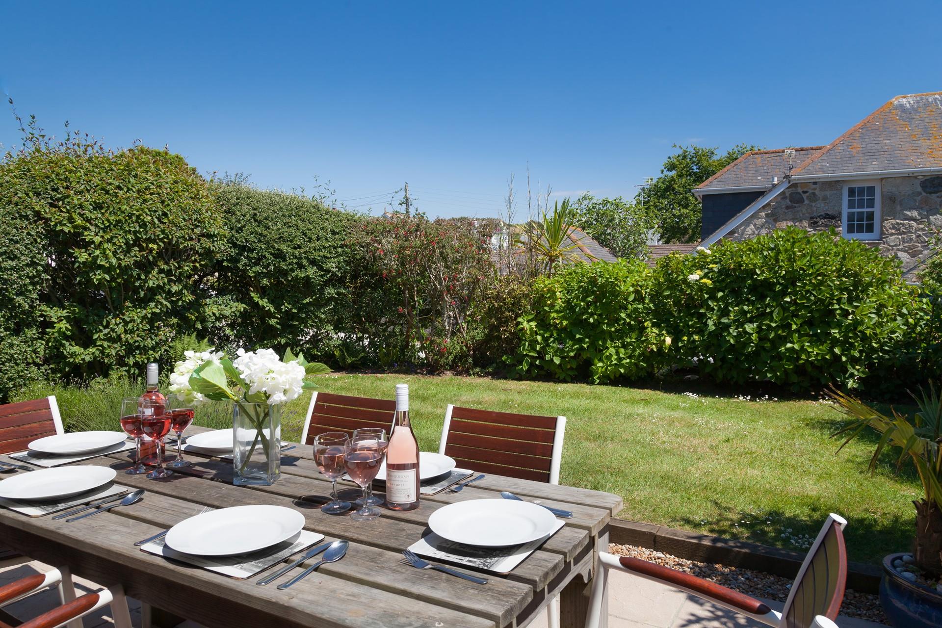 Secluded and peaceful, enjoy a meal together in the pretty garden.