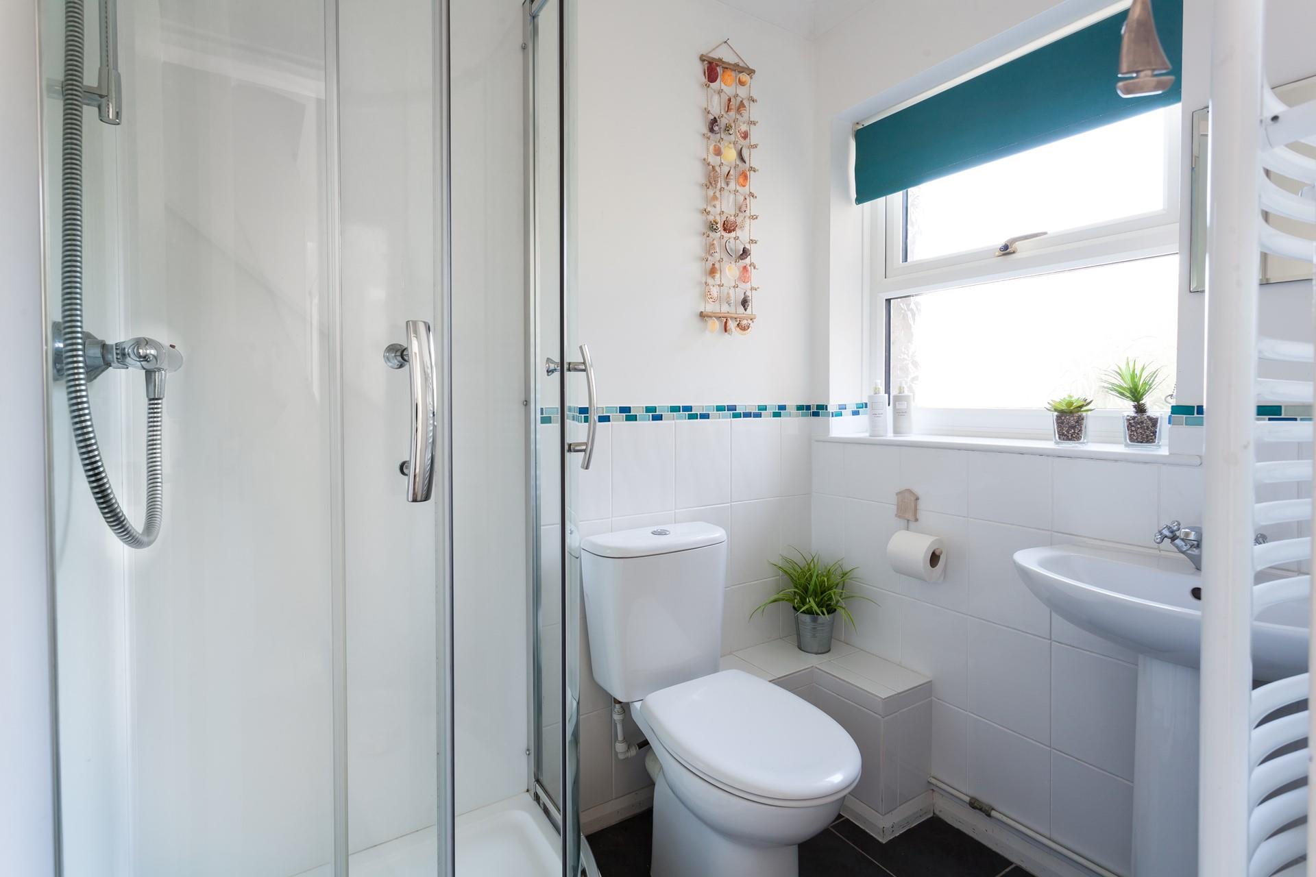 The downstairs shower room is ideal for washing off those sandy toes after a day at the beach. 