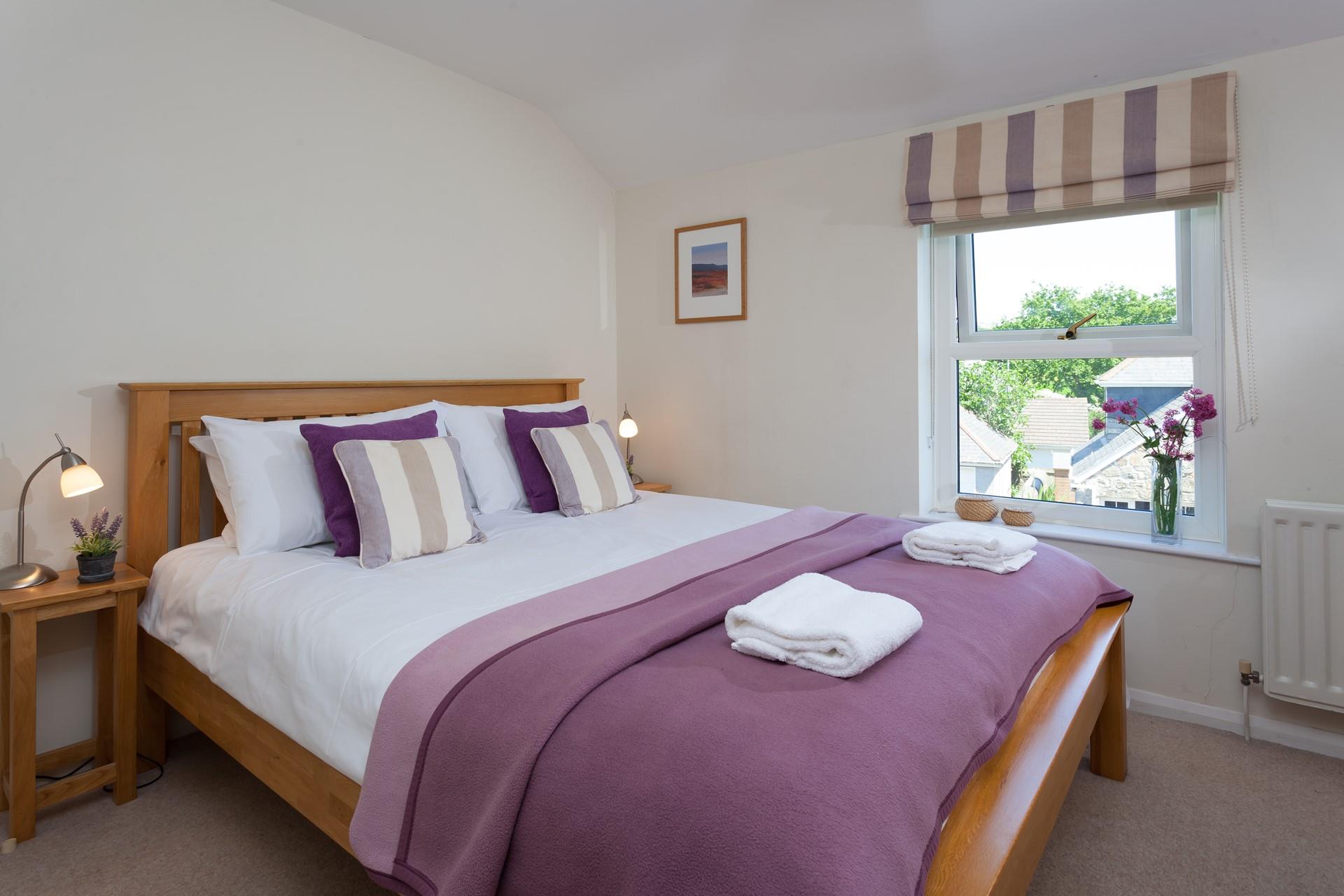 Light and spacious, you'll feel comfortable and relaxed in the main bedroom.