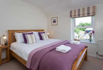 Light and spacious, you'll feel comfortable and relaxed in the main bedroom.