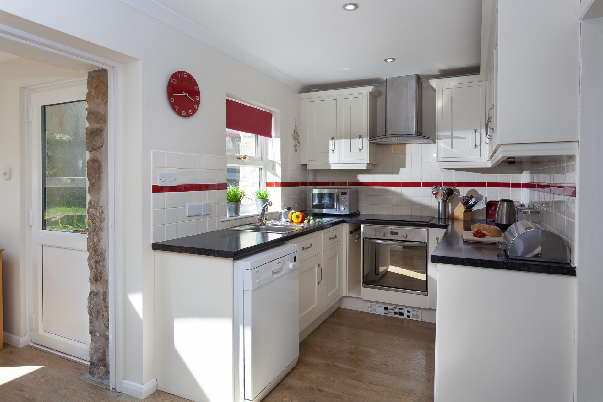 The semi open plan kitchen leads through to the lounge. 