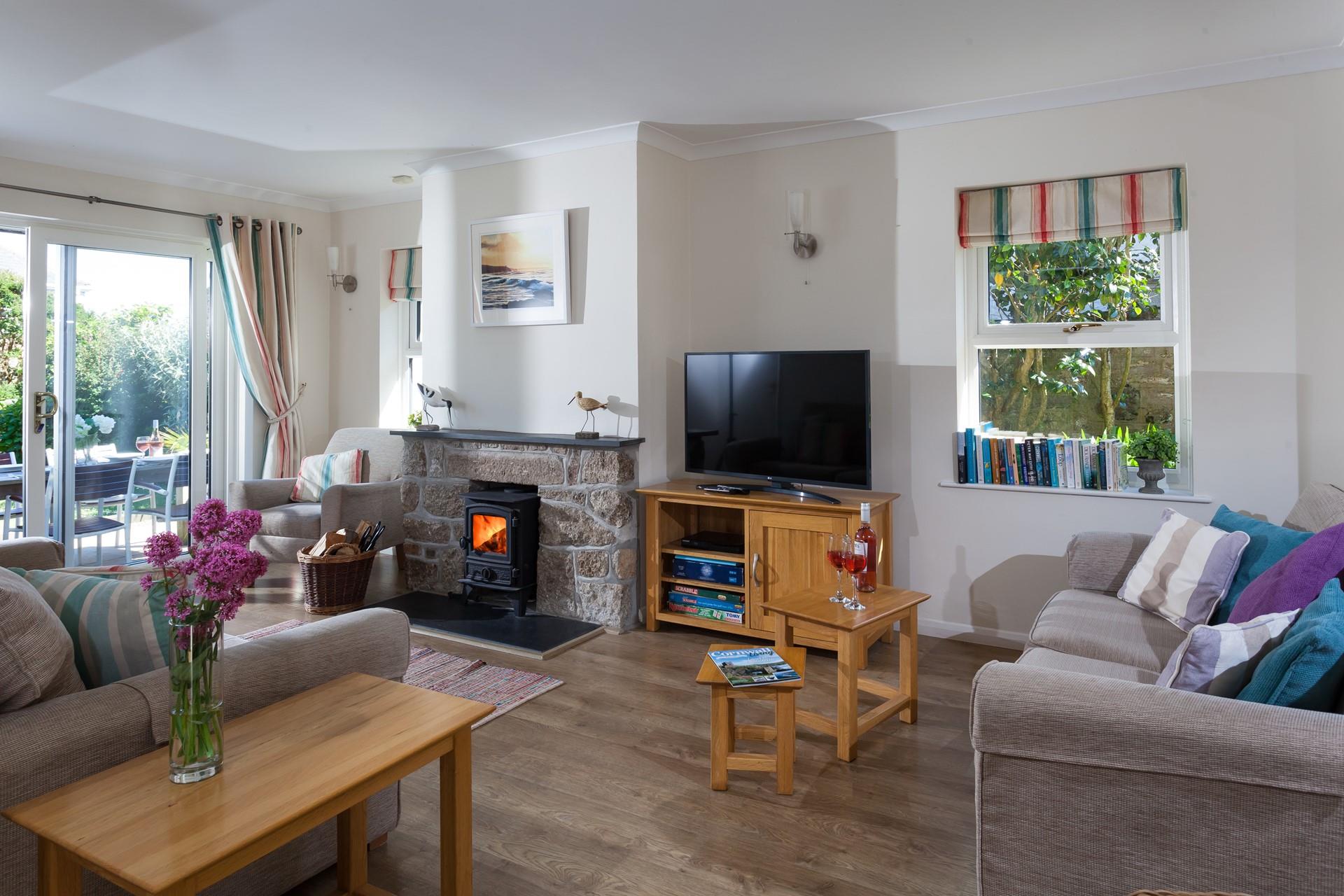 Triple aspect windows allow ample natural light to flow through the room. 