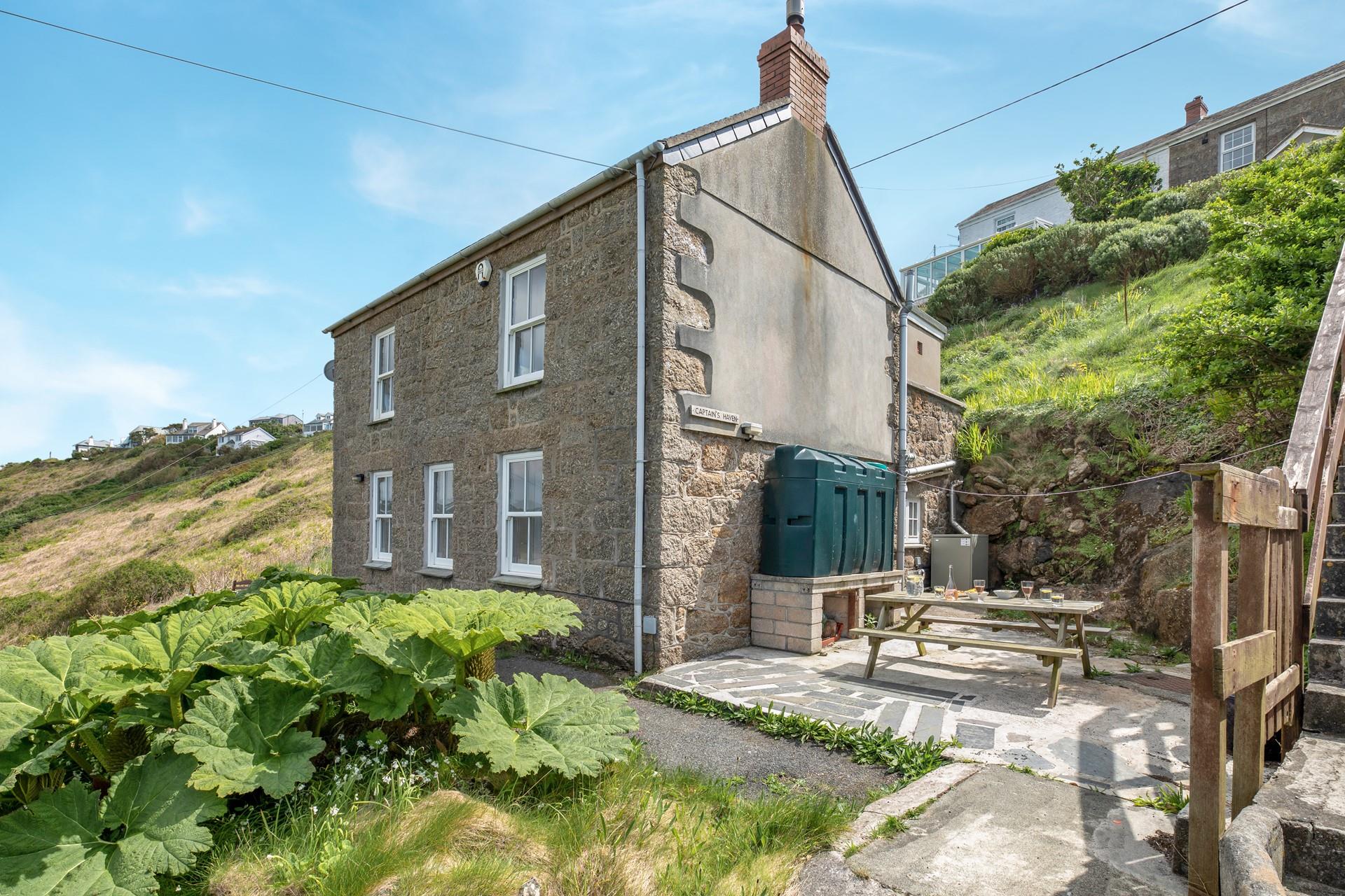 A traditional granite cottage just five minutes walk from the beach.