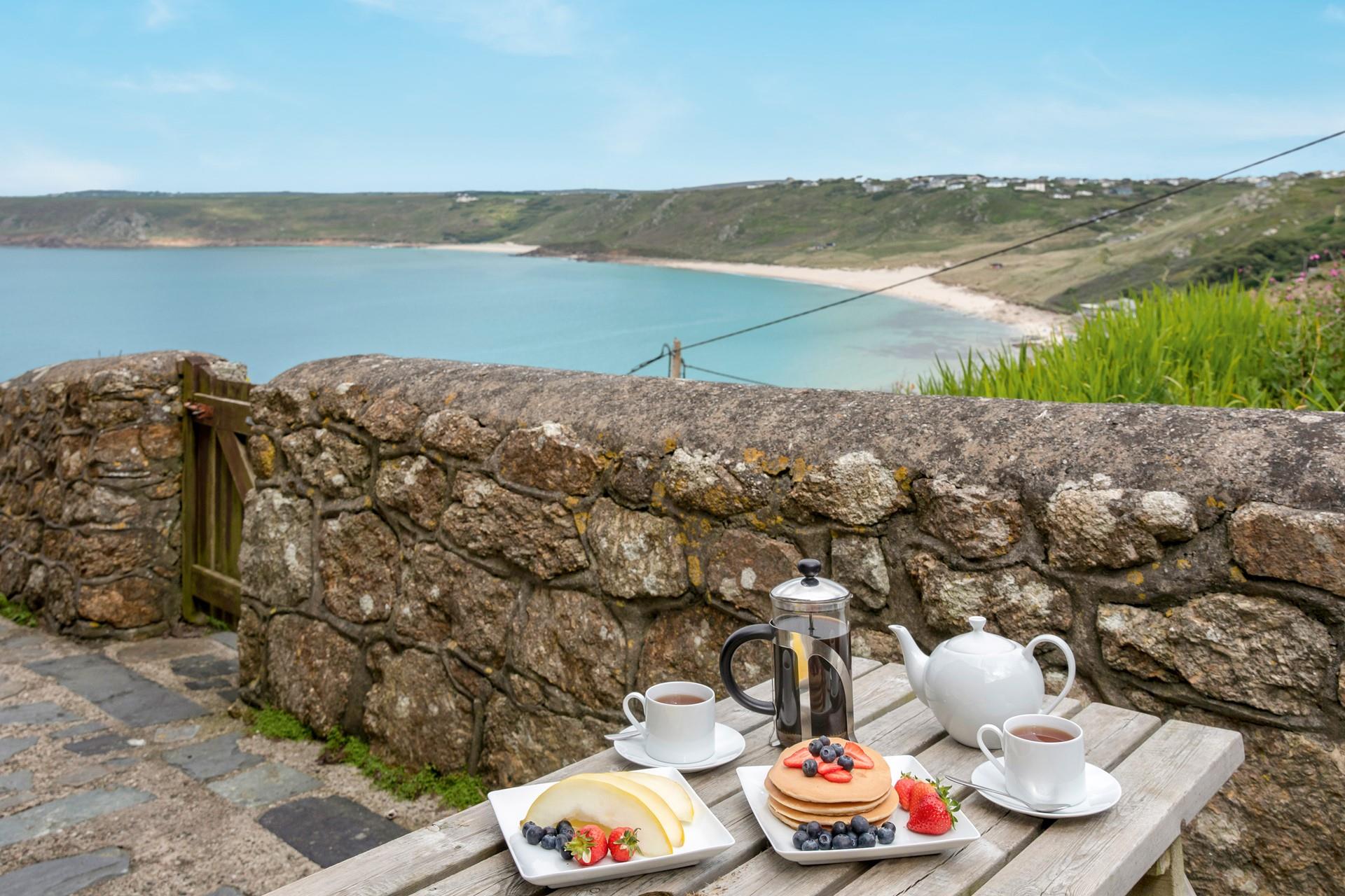 Enjoy breakfast with a view before heading out for a stroll down to the sand.