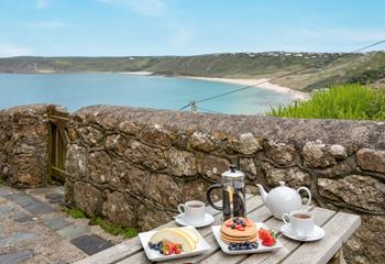 Enjoy breakfast with a view before heading out for a stroll down to the sand.