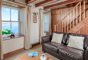 Natural wood interiors create a nautical feel in the cottage.