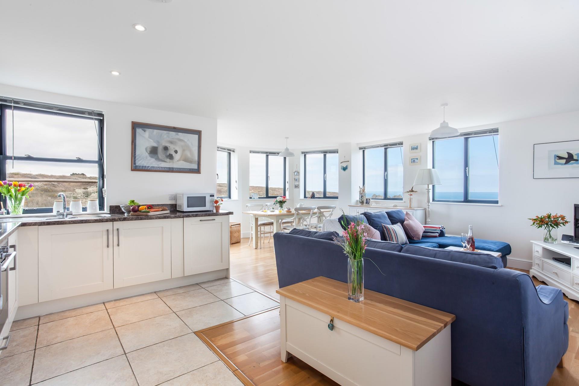 The open plan living space and kitchen provide a social environment for you to enjoy your holiday. 