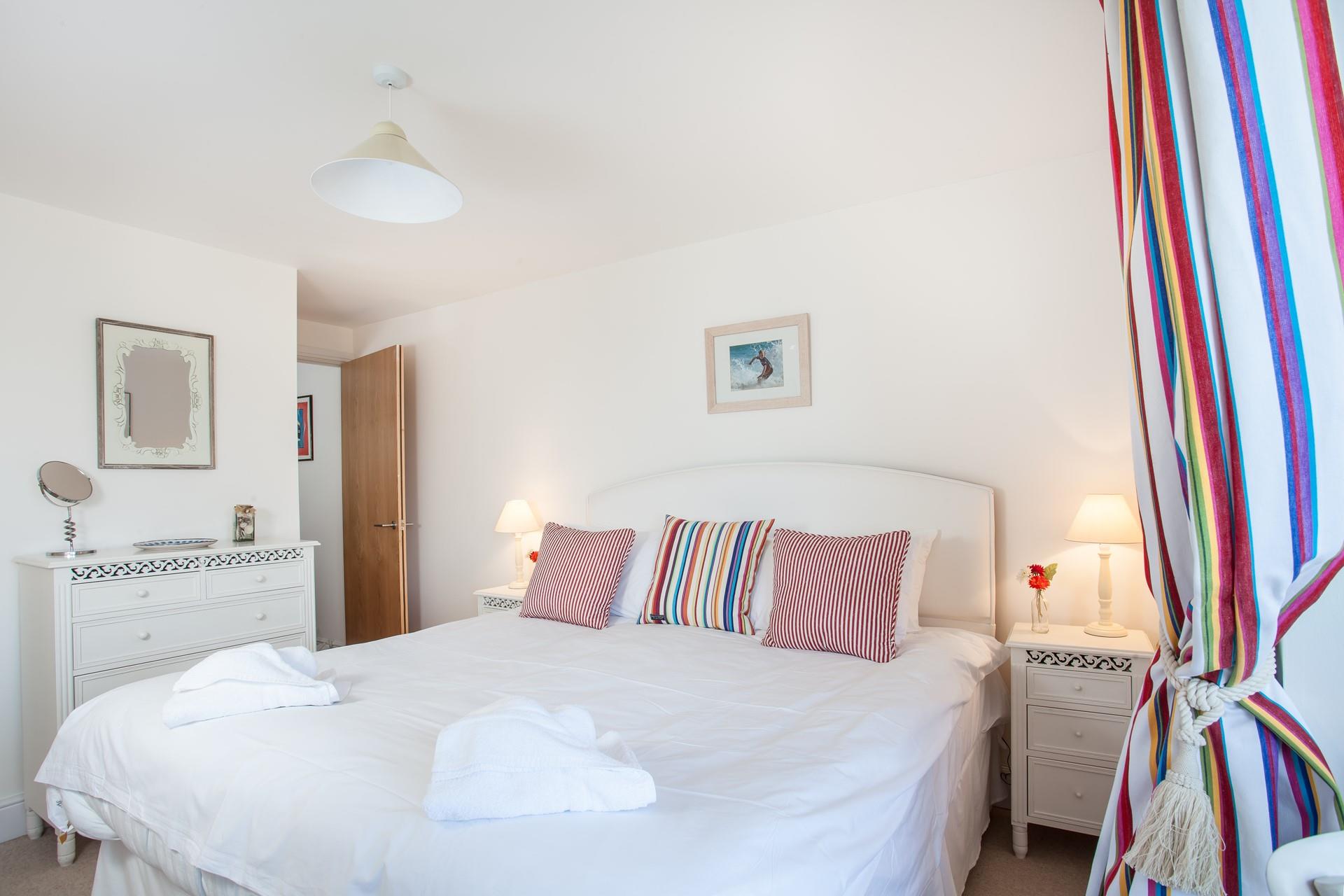 Bright, nautical stripes create a delightful bedroom.