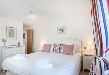 Bright, nautical stripes create a delightful bedroom.