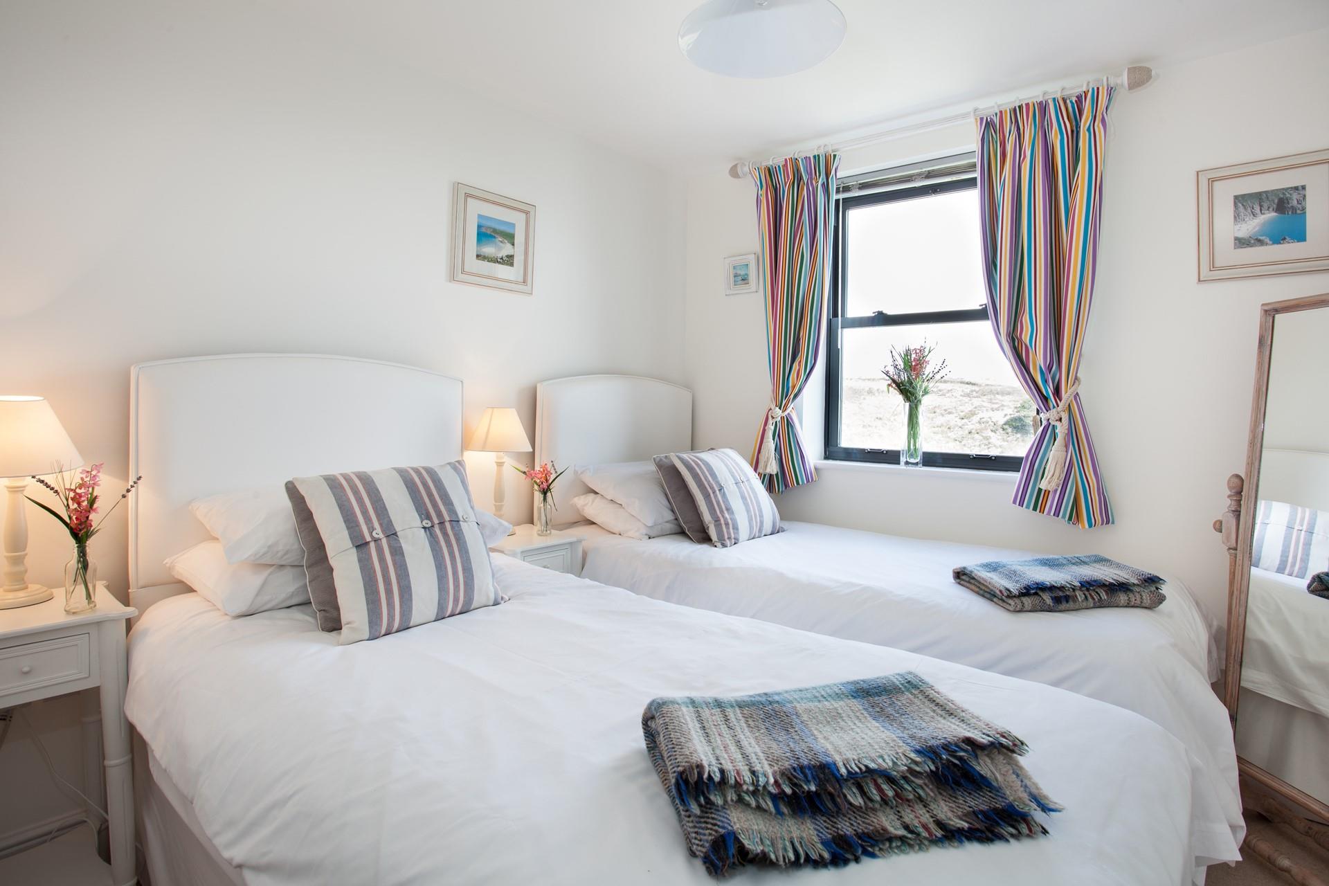 The twin bedroom is a charming retreat.