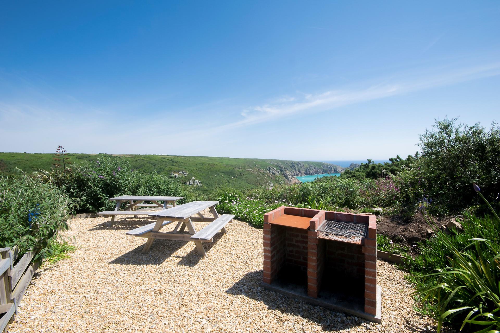 Cook up a feast in the communal barbecue, overlooking Porthcurno beach. 