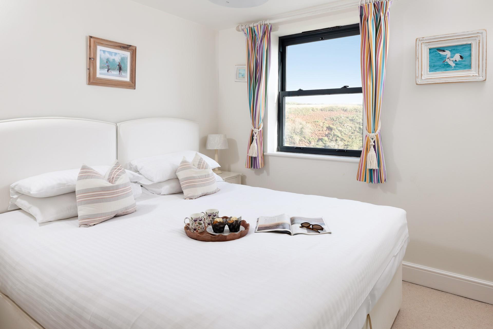Bedroom 2 features zip-and-link beds to suit every family. 