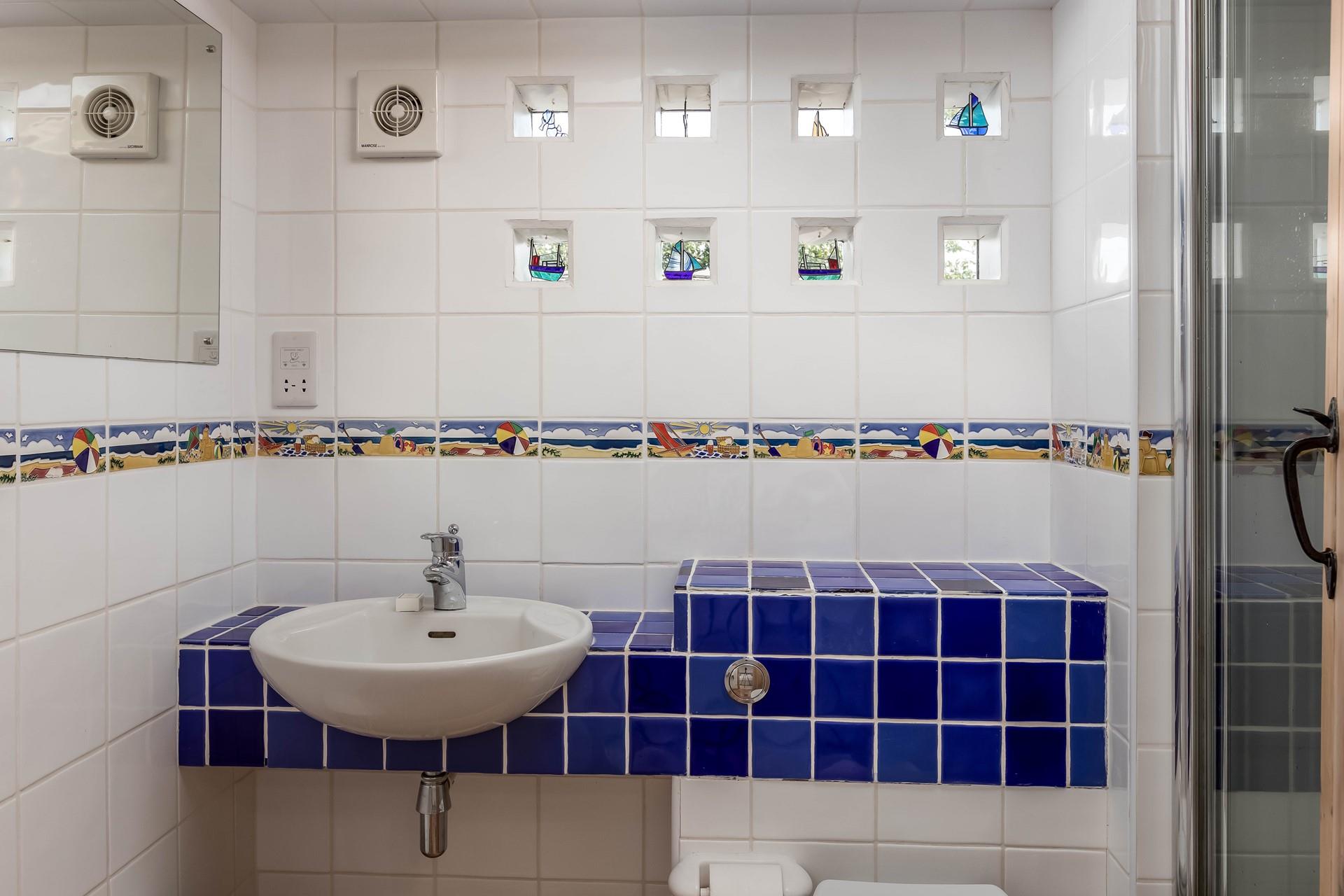 Wash off your sandy toes in the shower after a relaxing day at the beach.