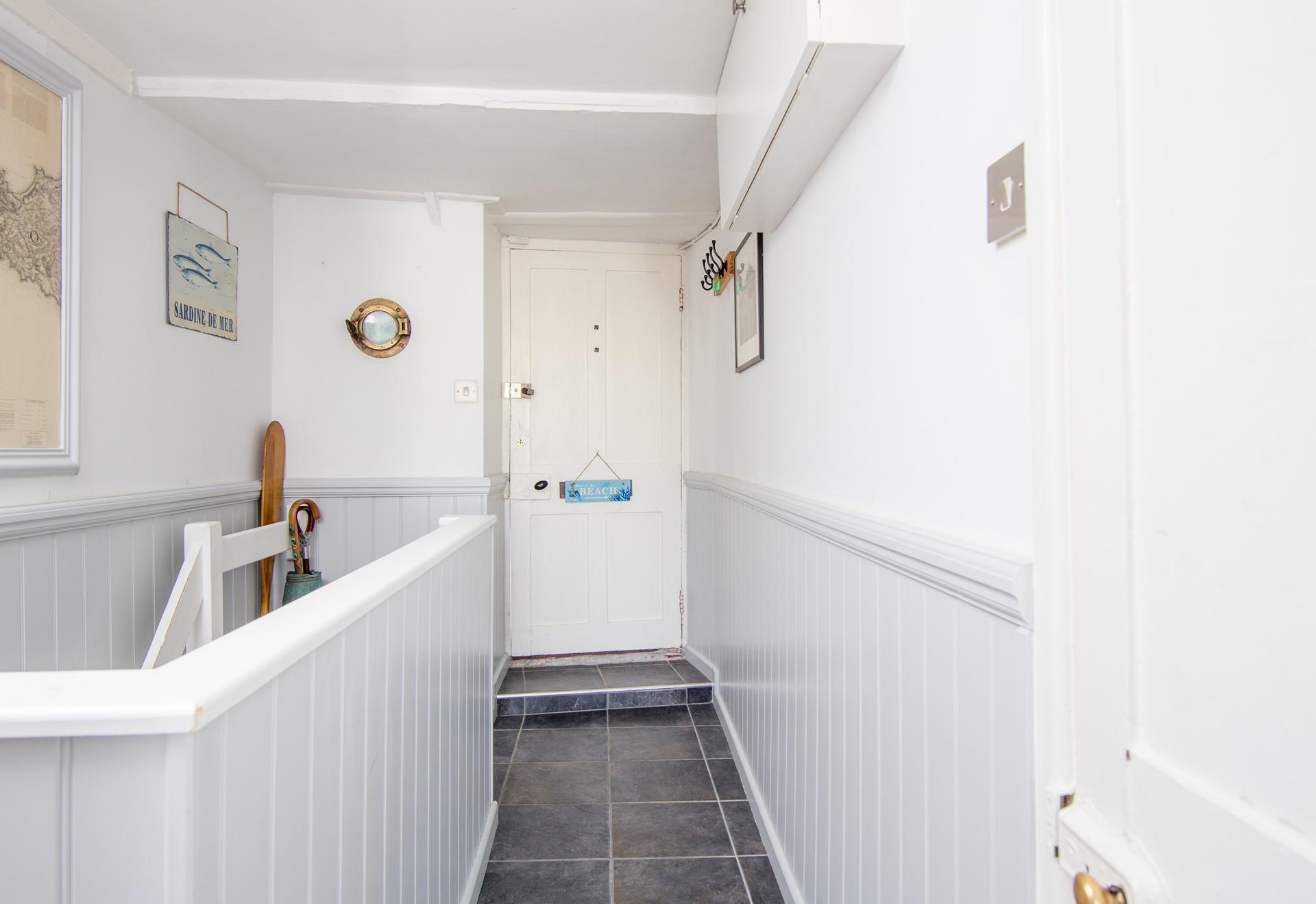 View from the bedroom and bath/shower room level looking at the street level entrance. 