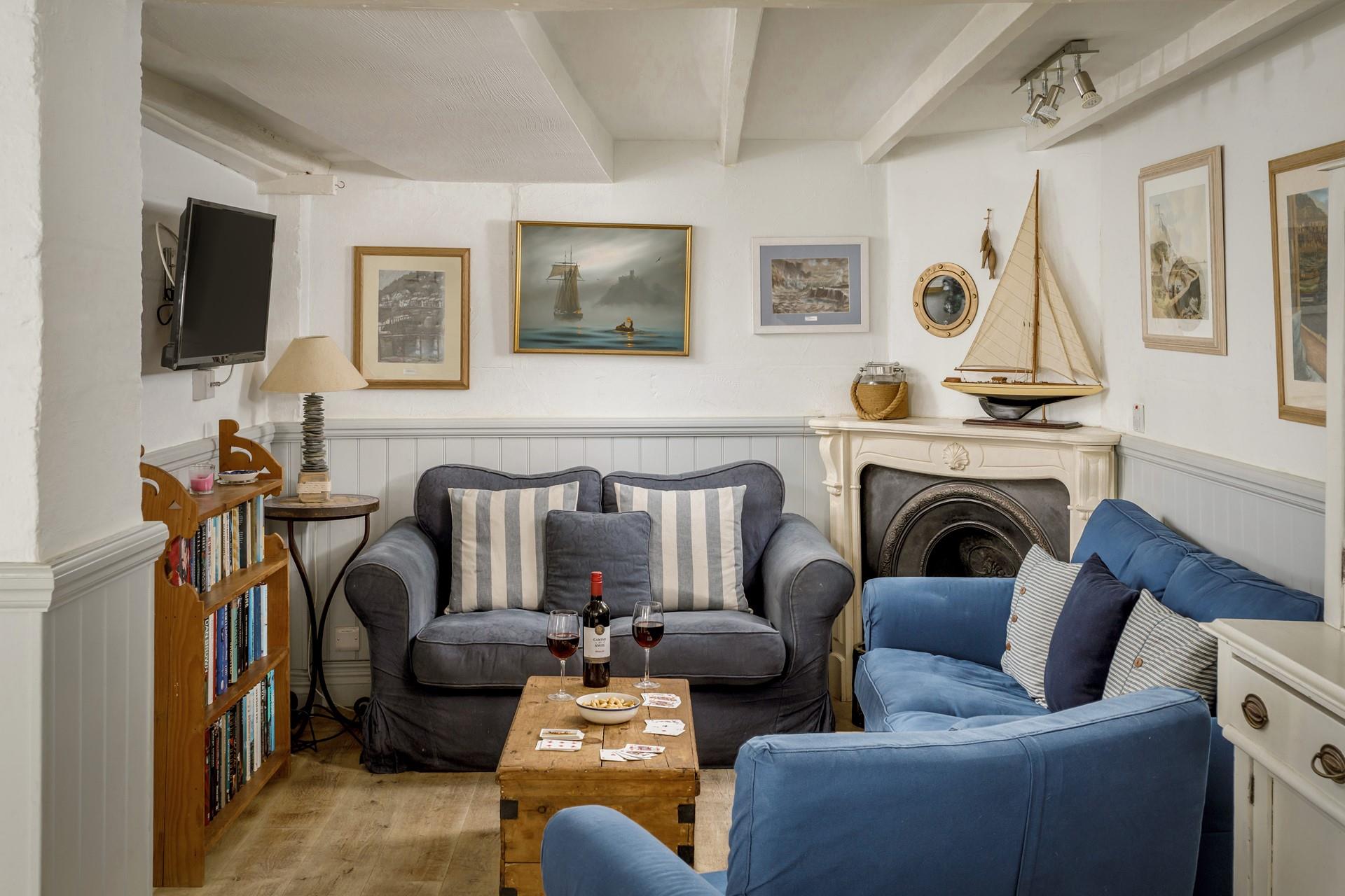 Handmade ornaments with a blue and white interior reflect a Cornish aesthetic. 