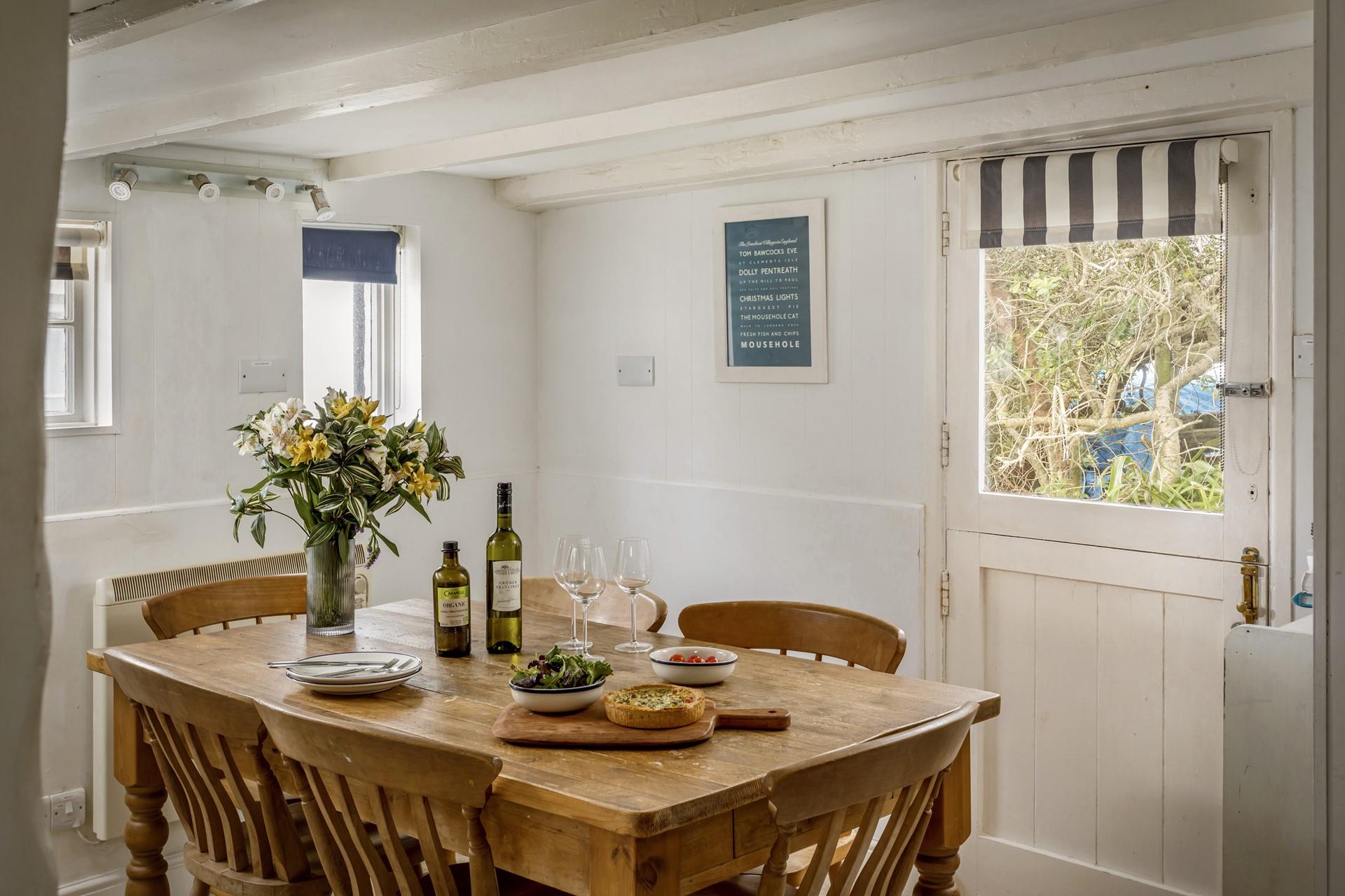 Wooden style seating adding to the beachy Cornish interior. 