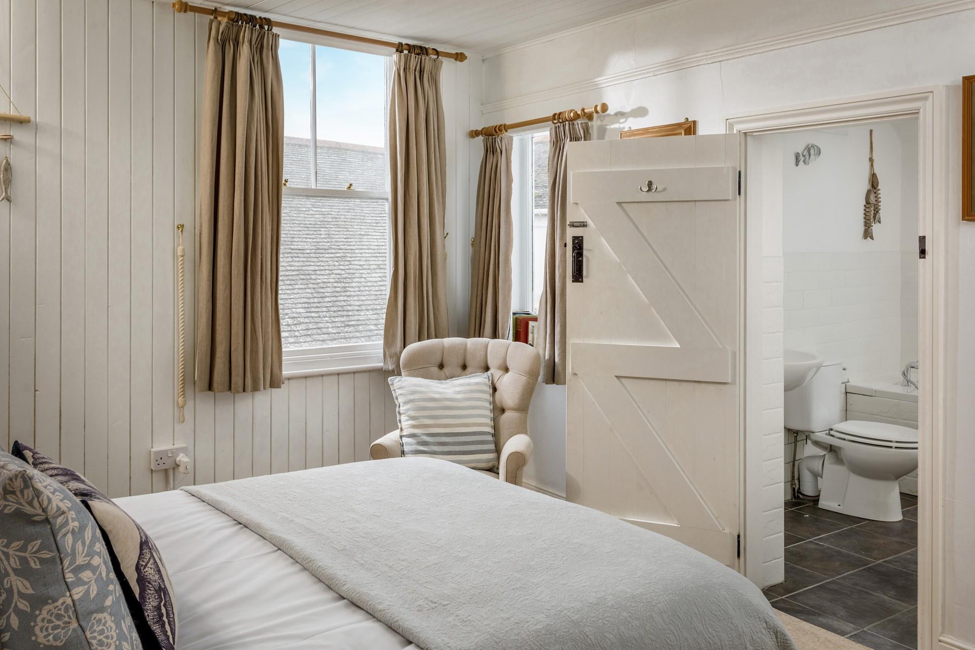 Bedroom 2 also has an en-suite and lots of seaside details. 