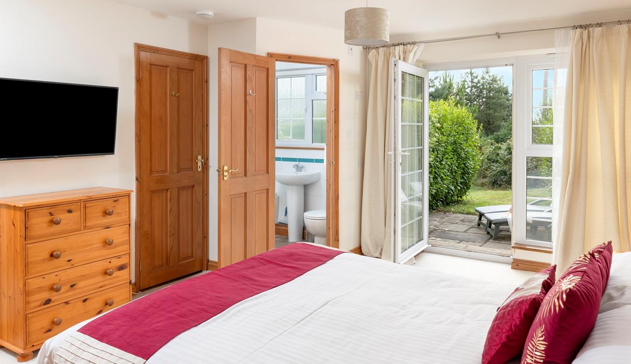 The master bedroom has patio doors leading out onto a sun terrace, the perfect place to sip your morning cuppa.