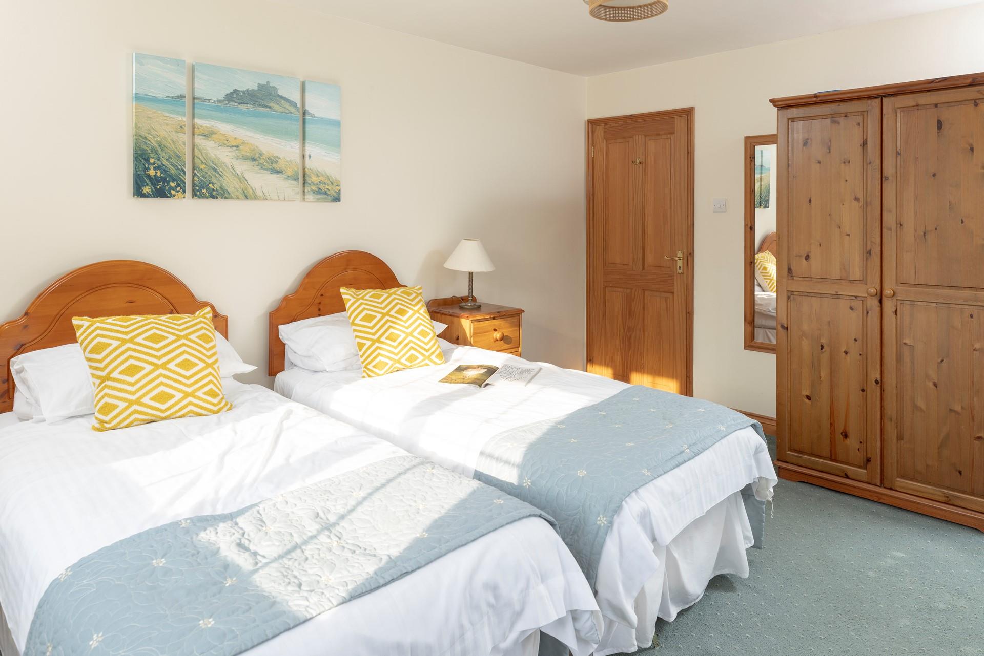 Calming coastal colours decorate the second bedroom.