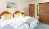 Calming coastal colours decorate the second bedroom. - Thumbnail Image