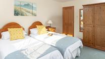 Calming coastal colours decorate the second bedroom.