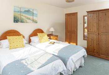 Calming coastal colours decorate the second bedroom.