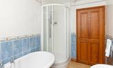 The family bathroom benefits from a separate shower cubicle. - Thumbnail Image
