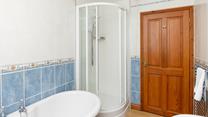 The family bathroom benefits from a separate shower cubicle.